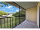 View from screened balcony of manicured green lawn and blue sky at 413 Somerset Ln, Palm Harbor, FL 34684
