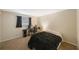Comfortable bedroom featuring neutral walls, carpeted floors, and versatile layout at 413 Somerset Ln, Palm Harbor, FL 34684