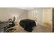 Comfortable bedroom featuring neutral walls, carpeted floors, and versatile layout at 413 Somerset Ln, Palm Harbor, FL 34684