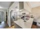 Efficient kitchen with stainless steel appliances and bright white cabinetry at 413 Somerset Ln, Palm Harbor, FL 34684