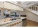 Open kitchen overlooks the dining and living area, perfect for entertaining and everyday living at 413 Somerset Ln, Palm Harbor, FL 34684