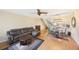 Open-concept living space featuring a modern kitchen with a breakfast bar and a comfortable living area at 413 Somerset Ln, Palm Harbor, FL 34684