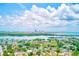 Expansive aerial view showcasing waterfront homes and cityscape views, highlighting the property's desirable location at 4228 Tarpon Se Dr, St Petersburg, FL 33705