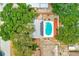 Aerial view of house featuring a backyard with solar panels, a fenced yard, and a kidney-shaped pool at 4228 Tarpon Se Dr, St Petersburg, FL 33705