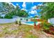 Spacious backyard pool area with tropical landscaping, offering a serene outdoor retreat at 4228 Tarpon Se Dr, St Petersburg, FL 33705
