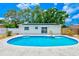 Refreshing backyard pool featuring a sun-soaked patio area and inviting steps for easy access at 4228 Tarpon Se Dr, St Petersburg, FL 33705