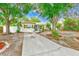 Charming single-story home showcasing a well-manicured front yard and a welcoming entrance at 4228 Tarpon Se Dr, St Petersburg, FL 33705
