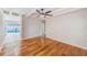 Bright and modern living room featuring wood floors and a view of the backyard swimming pool at 4228 Tarpon Se Dr, St Petersburg, FL 33705
