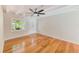 Bright living room with hardwood floors, a ceiling fan and a front entrance door at 4228 Tarpon Se Dr, St Petersburg, FL 33705