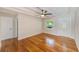 Bright living room with hardwood floors, a ceiling fan and a front entrance door at 4228 Tarpon Se Dr, St Petersburg, FL 33705