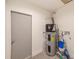 Utility area featuring a modern water heater with accessories, offering convenience and efficiency at 4228 Tarpon Se Dr, St Petersburg, FL 33705
