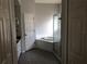 Bathroom featuring a garden tub, and separate glass-enclosed shower stall at 4512 River Overlook Dr, Valrico, FL 33596