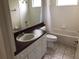 A well lit bathroom with a single sink vanity and a bathtub and shower at 4512 River Overlook Dr, Valrico, FL 33596