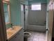 Bathroom featuring a single-sink vanity with modern fixtures and a shower-tub combination at 4512 River Overlook Dr, Valrico, FL 33596