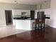 Bright kitchen with sleek stainless steel appliances, a breakfast bar, light walls and tile flooring at 4512 River Overlook Dr, Valrico, FL 33596