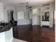 Large open living room featuring hardwood floors and breakfast bar to the bright kitchen with tile floors at 4512 River Overlook Dr, Valrico, FL 33596