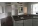 Bright living area with built-in shelving and breakfast bar overlooking the kitchen, perfect for casual dining at 4512 River Overlook Dr, Valrico, FL 33596