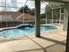 Inviting private pool and spa with screened enclosure, with tranquil water feature and ample patio space at 4512 River Overlook Dr, Valrico, FL 33596