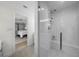 Bathroom with sleek shower and view into bedroom at 4705 W Estrella St, Tampa, FL 33629