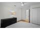 Clean and bright bedroom features a ceiling fan, wood floor, and a spacious closet at 4705 W Estrella St, Tampa, FL 33629