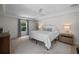Bright bedroom with a white bed, neutral walls, and lots of natural light at 4705 W Estrella St, Tampa, FL 33629