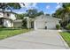 Charming single Gathering home with mature landscaping, attached two car garage, and inviting front entry at 4705 W Estrella St, Tampa, FL 33629