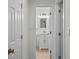 Hallway view of a bright bathroom with modern fixtures and a marble countertop vanity at 4705 W Estrella St, Tampa, FL 33629