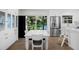 Modern kitchen with island seating, stainless steel refrigerator, and bright breakfast area at 4705 W Estrella St, Tampa, FL 33629