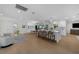 Open-concept kitchen and living area featuring an island with seating and modern finishes at 4705 W Estrella St, Tampa, FL 33629