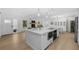 Bright kitchen featuring a large island, modern appliances, and a seamless flow to living spaces at 4705 W Estrella St, Tampa, FL 33629