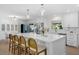 Bright eat-in kitchen boasts a large island, stainless appliances, and backyard view at 4705 W Estrella St, Tampa, FL 33629