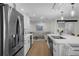 Spacious kitchen with stainless steel appliances, a large island, and an open layout to living area at 4705 W Estrella St, Tampa, FL 33629
