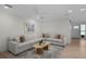 Bright living room featuring a large sectional sofa, stylish coffee table, and neutral tones at 4705 W Estrella St, Tampa, FL 33629