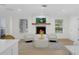 Comfortable living space featuring a fireplace, natural light, and an open layout at 4705 W Estrella St, Tampa, FL 33629