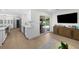 Open concept living room featuring modern finishes and a seamless connection to the outdoor patio at 4705 W Estrella St, Tampa, FL 33629