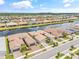 Beautiful community aerial view with water views, meticulously landscaped lawns, and tiled roofs at 4914 Sienna Isles Ave, Wimauma, FL 33598