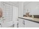 Clean and stylish bathroom with a shower-tub combo, white subway tile, and modern fixtures at 4914 Sienna Isles Ave, Wimauma, FL 33598