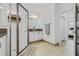 Modern bathroom showcasing a glass shower, white vanity, and neutral tile flooring at 4914 Sienna Isles Ave, Wimauma, FL 33598