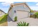 Charming home featuring paver driveway, beige garage door, well-kept lawn, and professional landscaping at 4914 Sienna Isles Ave, Wimauma, FL 33598
