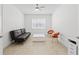 Modern living room featuring a sofa, bright white walls, tile floors, and contemporary furnishings at 4914 Sienna Isles Ave, Wimauma, FL 33598
