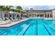 Resort-style pool with lap lanes, cabanas, and lounge chairs provides a luxurious outdoor experience at 4914 Sienna Isles Ave, Wimauma, FL 33598