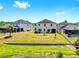 This backyard has a large grassy area with a scenic view, perfect for outdoor activities and relaxation at 5040 Inshore Landing Dr, Apollo Beach, FL 33572