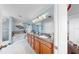 Beautiful bathroom with double sinks, granite counters, soaking tub, and separate tiled shower at 5040 Inshore Landing Dr, Apollo Beach, FL 33572
