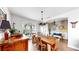 Charming dining area with a wooden table, chandelier, and decorative accents for elegant meals at 5040 Inshore Landing Dr, Apollo Beach, FL 33572