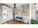 Cozy foyer featuring stylish decor, a wooden bench with colorful cushions, and a welcoming ambiance at 5040 Inshore Landing Dr, Apollo Beach, FL 33572