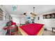 Fun game room featuring a pool table, comfortable seating, and a playful decor for entertainment at 5040 Inshore Landing Dr, Apollo Beach, FL 33572