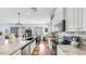 Beautiful kitchen with granite counters, stainless appliances, and a farmhouse sink at 5040 Inshore Landing Dr, Apollo Beach, FL 33572