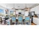 Bright eat-in kitchen with granite counters, stainless appliances, breakfast bar, and brick accent wall at 5040 Inshore Landing Dr, Apollo Beach, FL 33572