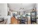 Open concept kitchen with breakfast nook, farmhouse sink, stainless appliances and hardwood floors at 5040 Inshore Landing Dr, Apollo Beach, FL 33572
