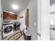 Functional laundry room with modern washer and dryer, ample storage, and a convenient layout for household chores at 5040 Inshore Landing Dr, Apollo Beach, FL 33572
